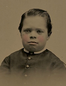 antique daguerreotype of a boy in his Sunday best
